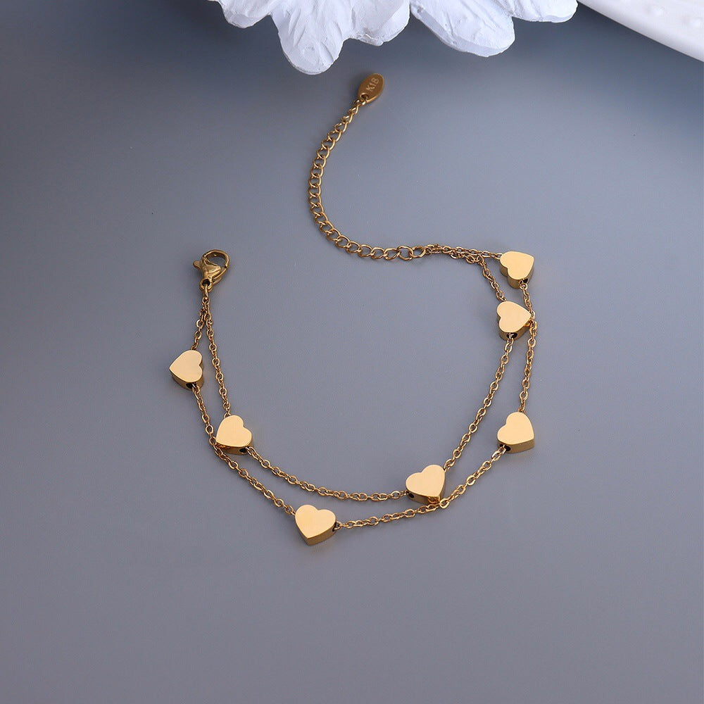 Veyra Damenarmband Doppelherz – Titanstahl Gold